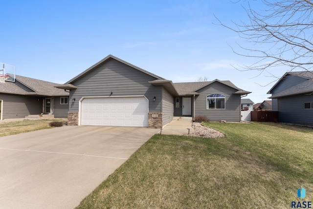 single story home with a garage, fence, concrete driveway, brick siding, and a front lawn