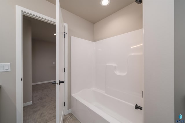 full bathroom with baseboards and shower / bathtub combination