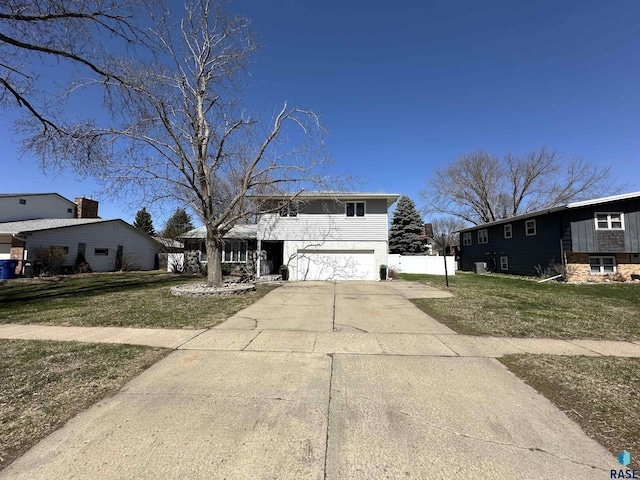 1200 Crestview Dr, Vermillion, SD 57069 - view of front of property featuring a garage, driveway, and a front yard