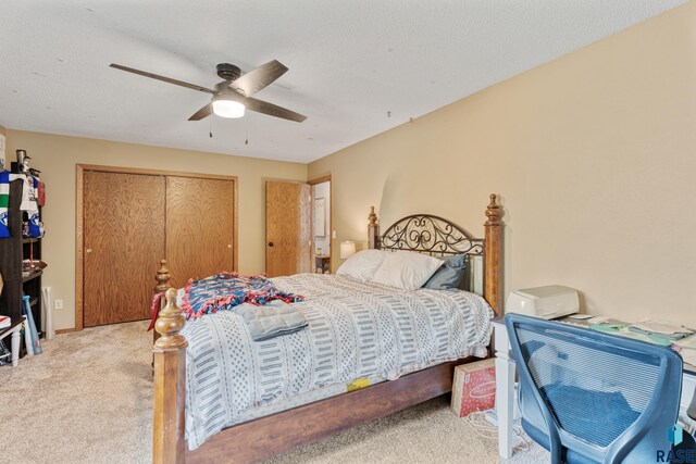 1200 Crestview Dr, Vermillion, SD 57069 - bedroom featuring carpet, a closet, and a ceiling fan