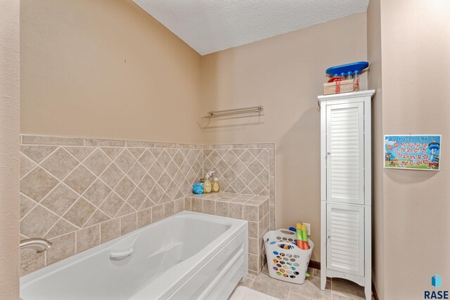 1200 Crestview Dr, Vermillion, SD 57069 - bathroom with a bath, tile patterned flooring, and a textured ceiling