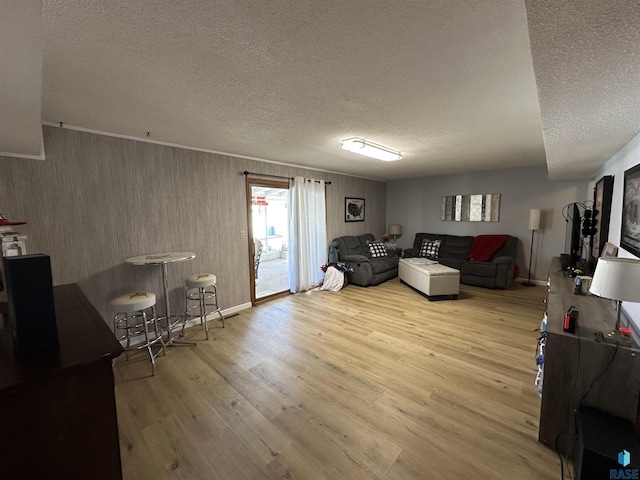 1200 Crestview Dr, Vermillion, SD 57069 - living area featuring a textured ceiling, wood finished floors, and baseboards