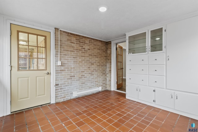 1205 Douglas Ave, Yankton, SD 57078 - doorway to property with a baseboard heating unit