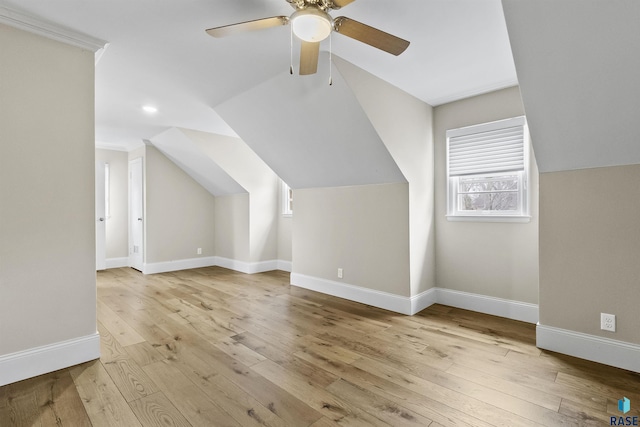 1205 Douglas Ave, Yankton, SD 57078 - additional living space featuring vaulted ceiling, hardwood / wood-style flooring, baseboards, and a ceiling fan