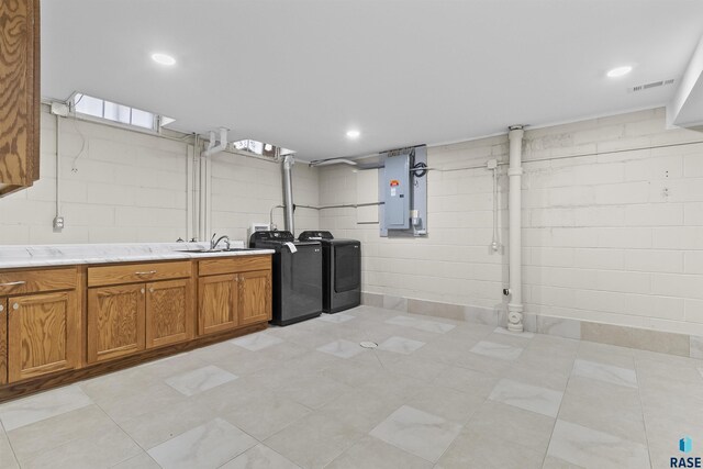 1205 Douglas Ave, Yankton, SD 57078 - interior space featuring visible vents, electric panel, light countertops, brown cabinets, and washing machine and dryer