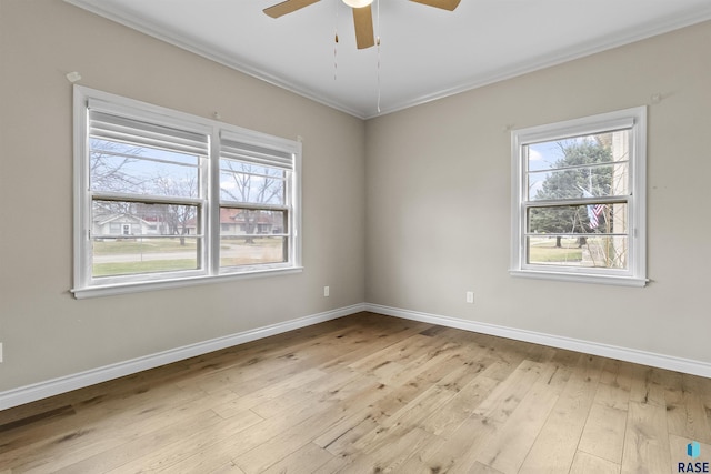 1205 Douglas Ave, Yankton, SD 57078 - unfurnished room with ornamental molding, wood-type flooring, ceiling fan, and baseboards