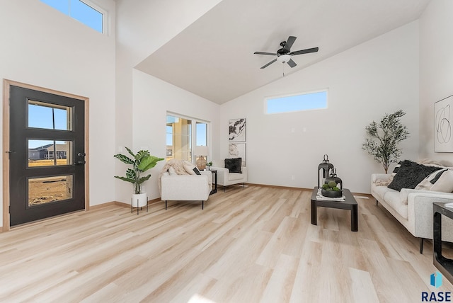 5709 S Spirea Ave, Sioux Falls, SD 57106 - living area with baseboards, high vaulted ceiling, light wood-style floors, and a ceiling fan