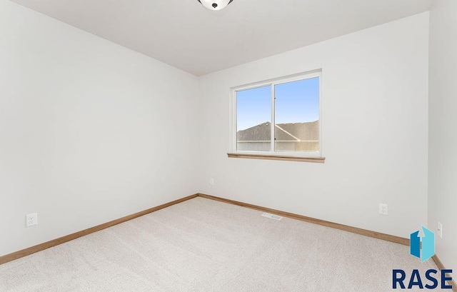 5709 S Spirea Ave, Sioux Falls, SD 57106 - unfurnished room with baseboards, visible vents, and carpet floors