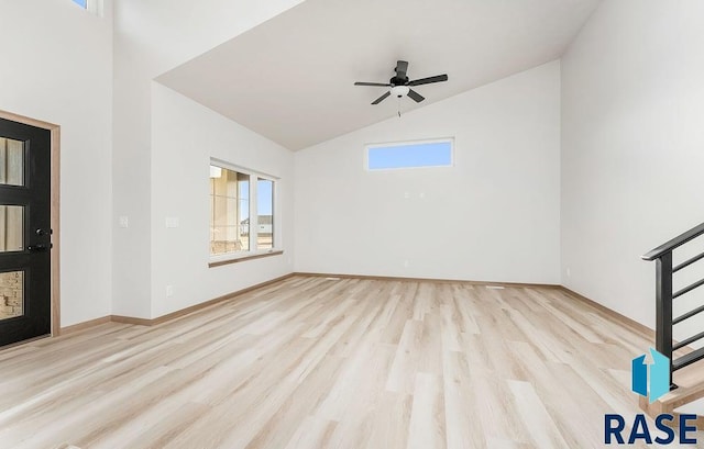 5709 S Spirea Ave, Sioux Falls, SD 57106 - interior space featuring high vaulted ceiling, baseboards, a ceiling fan, and wood finished floors