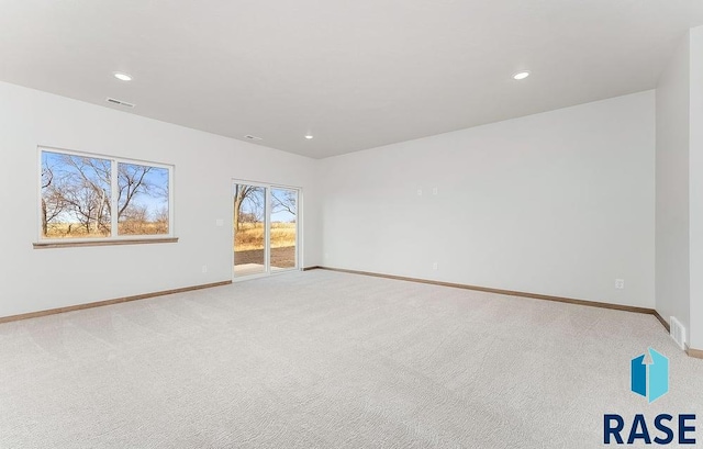5709 S Spirea Ave, Sioux Falls, SD 57106 - unfurnished room with visible vents, baseboards, recessed lighting, and light carpet
