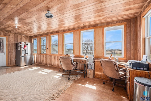 office space featuring wood ceiling, wood walls, and light wood-type flooring