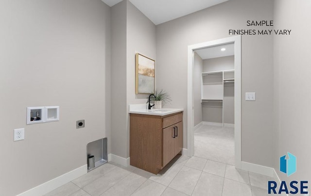 8312 E Wicker Ct, Sioux Falls, SD 57110 - washroom with baseboards, washer hookup, a sink, laundry area, and electric dryer hookup