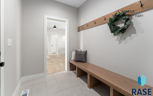 8312 E Wicker Ct, Sioux Falls, SD 57110 - mudroom featuring visible vents, baseboards, and light tile patterned floors