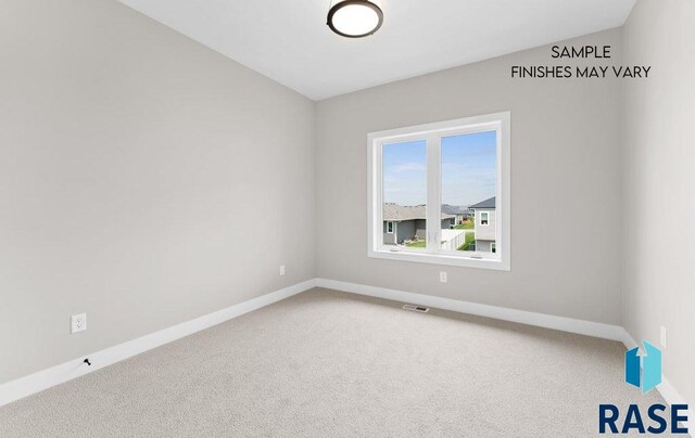 8312 E Wicker Ct, Sioux Falls, SD 57110 - empty room featuring visible vents, baseboards, and carpet floors