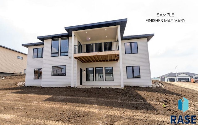 8312 E Wicker Ct, Sioux Falls, SD 57110 - rear view of property featuring a balcony