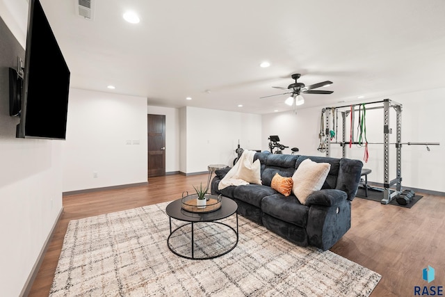 living room with recessed lighting, visible vents, a ceiling fan, and wood finished floors