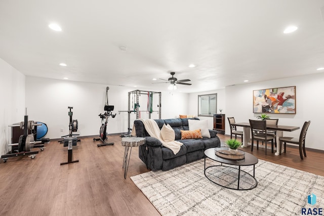 living area with wood finished floors, ceiling fan, baseboards, and recessed lighting