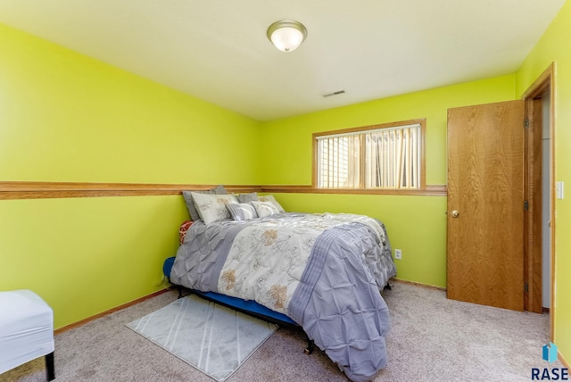 carpeted bedroom with visible vents