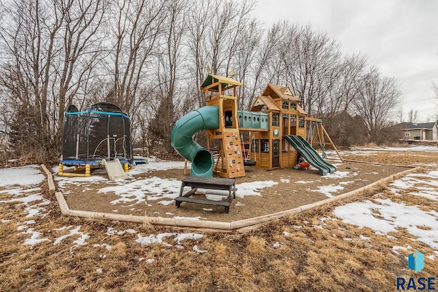 snow covered playground with a trampoline and playground community