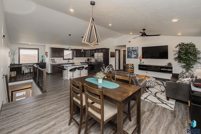 23744 461a Ave # 2, Wentworth, SD 57075 - dining area with light wood-style flooring, a ceiling fan, and lofted ceiling