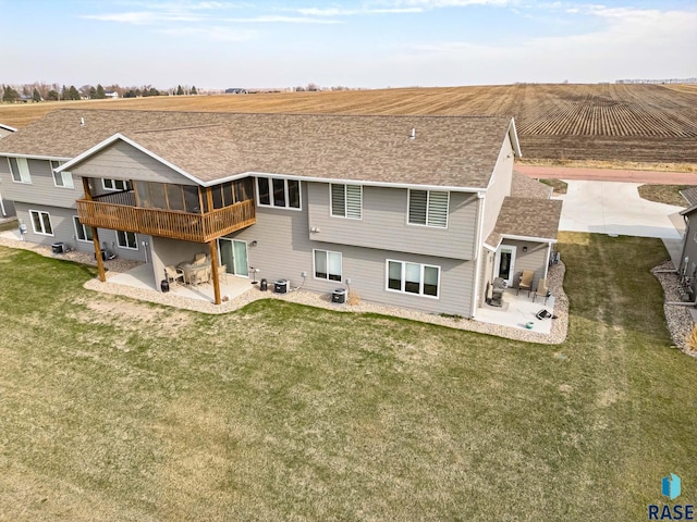 23744 461a Ave # 2, Wentworth, SD 57075 - rear view of house featuring a lawn, cooling unit, a patio, and a sunroom