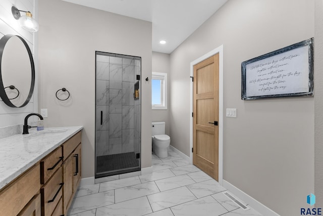 full bath featuring a shower stall, marble finish floor, baseboards, and toilet