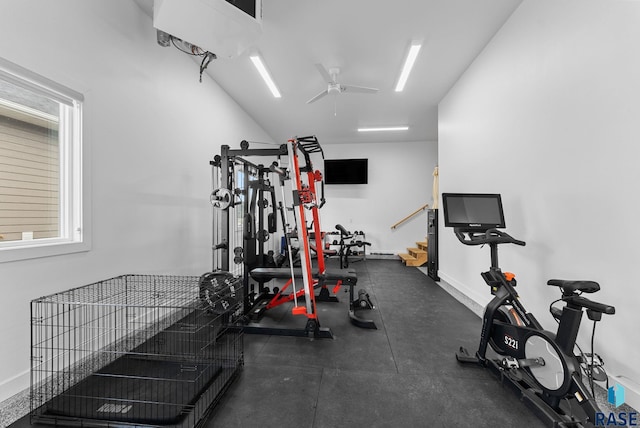 exercise room featuring baseboards and a ceiling fan