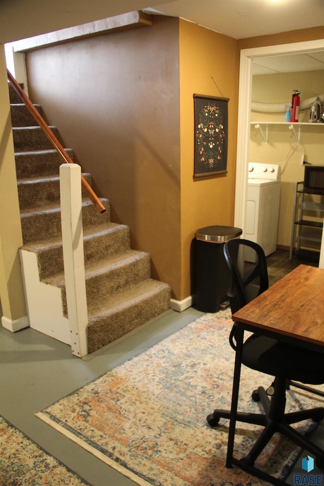 home office featuring baseboards and washer / clothes dryer