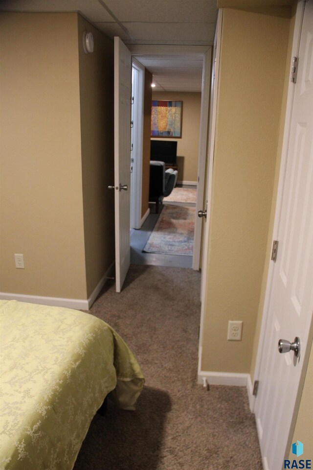 carpeted bedroom featuring baseboards