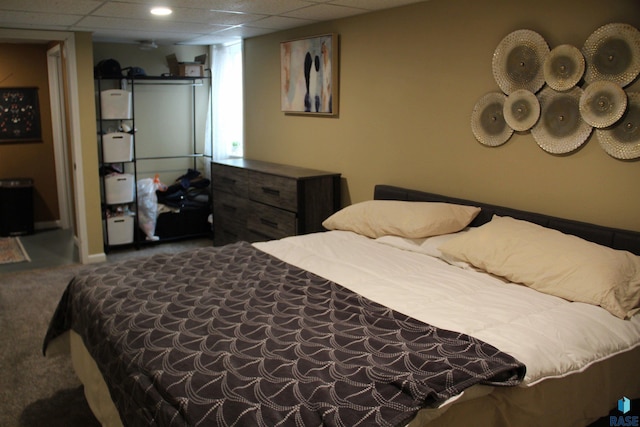 carpeted bedroom featuring baseboards
