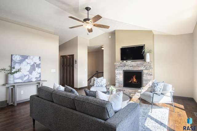 living area with ceiling fan, baseboards, wood finished floors, and a fireplace