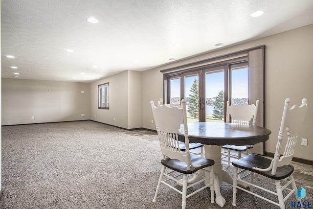 dining room with recessed lighting, carpet flooring, and baseboards