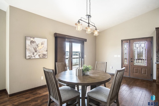dining space with baseboards and dark wood-style floors