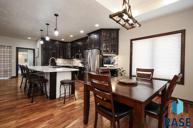 105 N Nora St, Viborg, SD 57070 - dining space with wood finished floors, baseboards, and recessed lighting