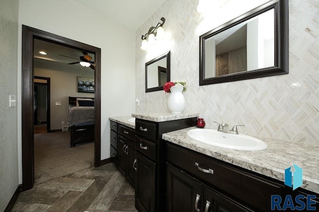 105 N Nora St, Viborg, SD 57070 - ensuite bathroom with ensuite bathroom, baseboards, a ceiling fan, and vanity
