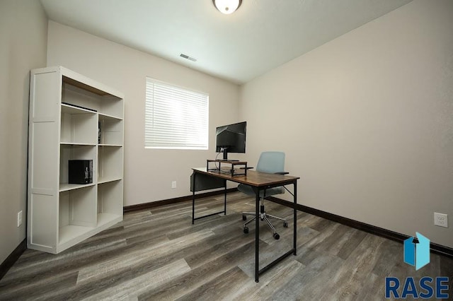 105 N Nora St, Viborg, SD 57070 - office featuring visible vents, baseboards, and wood finished floors