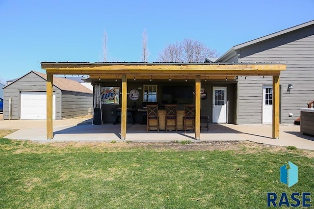 105 N Nora St, Viborg, SD 57070 - view of patio / terrace with an outbuilding and a garage