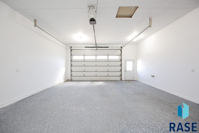 105 N Nora St, Viborg, SD 57070 - garage featuring a garage door opener