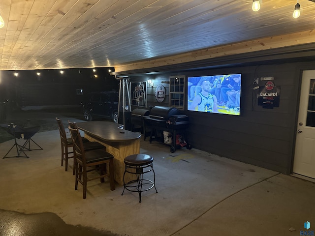 105 N Nora St, Viborg, SD 57070 - dining area featuring concrete floors and wooden ceiling