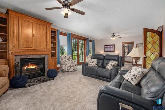 28128 462nd Ave, Davis, SD 57021 - living room with a textured ceiling, ceiling fan, a fireplace, and carpet