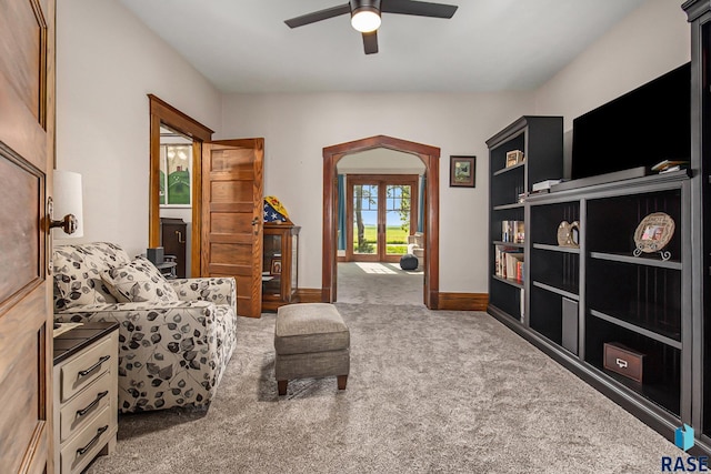 28128 462nd Ave, Davis, SD 57021 - living area featuring baseboards, a ceiling fan, and carpet flooring