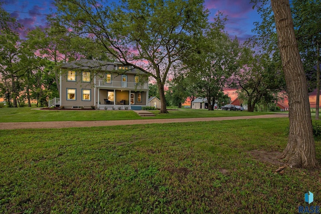 28128 462nd Ave, Davis, SD 57021 - view of front of home featuring a porch, a front lawn, and a balcony
