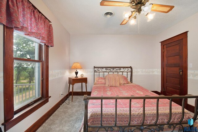 28128 462nd Ave, Davis, SD 57021 - carpeted bedroom featuring ceiling fan, baseboards, and visible vents