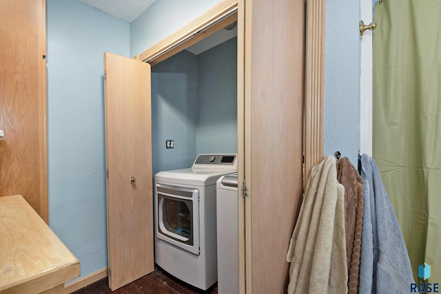 28128 462nd Ave, Davis, SD 57021 - clothes washing area featuring separate washer and dryer, laundry area, and dark wood-style floors