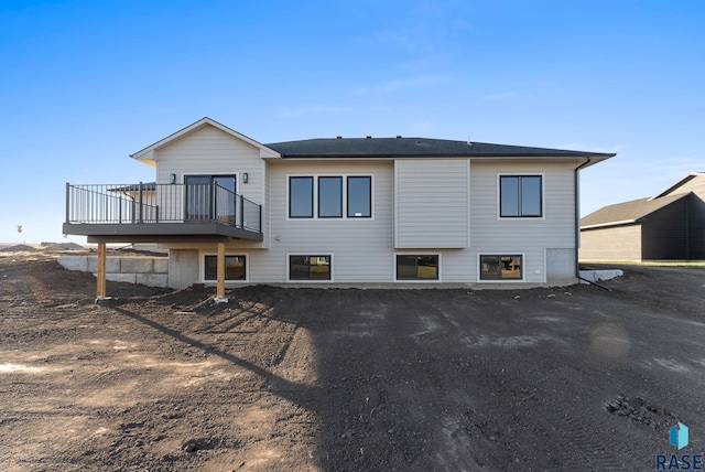 back of property featuring a deck