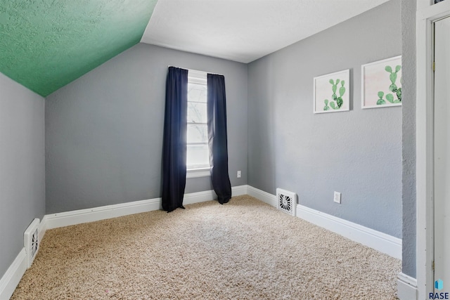 bonus room featuring carpet floors, baseboards, visible vents, and lofted ceiling
