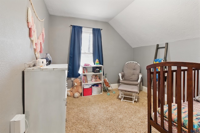 carpeted bedroom with a nursery area, baseboards, and lofted ceiling
