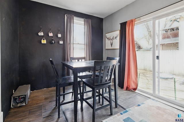 dining area with wood finished floors and a wealth of natural light