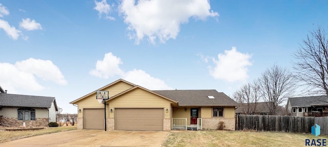 view of front of property featuring brick siding, an attached garage, and driveway