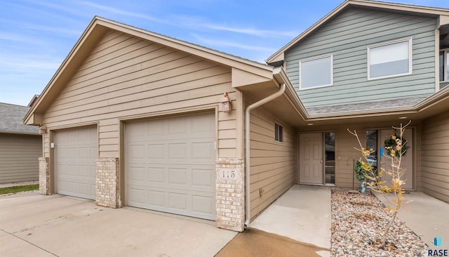 view of front of home with an attached garage and driveway